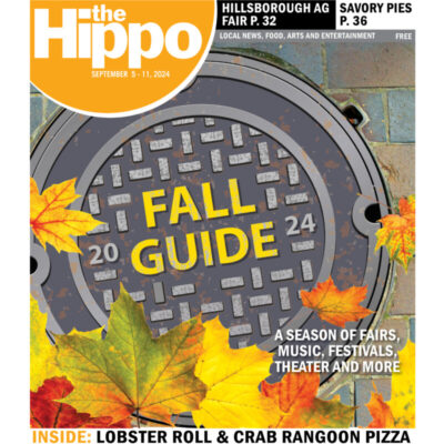 frontpage of hippo featuring a manhole cover with the words Fall Guide in yellow, partially covered by leaves