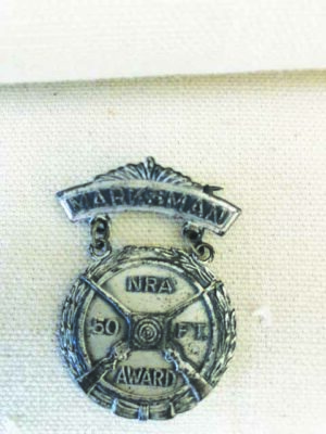 antique badge or medal that looks a little worn