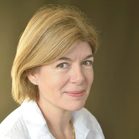 headshot of older woman, slight smile, light shirt, short, straight hair