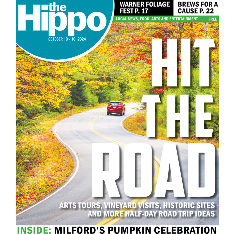 cover of the Hippo showing car driving down curvy road surrounded by trees with autumn leaves