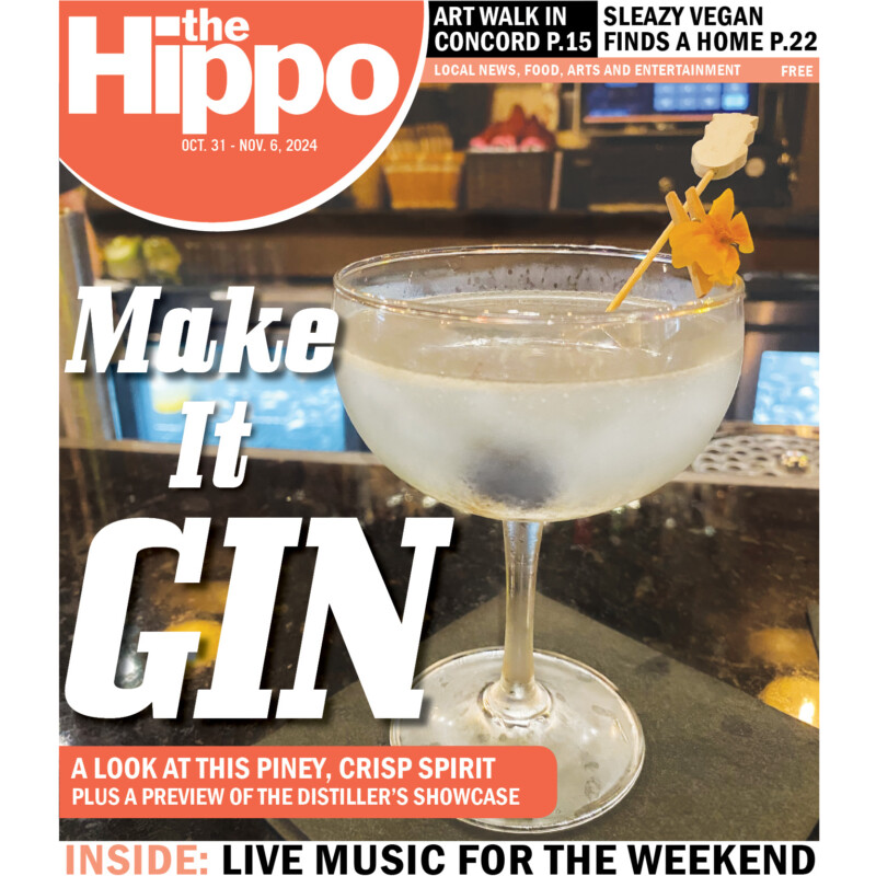 front page of Hippo weekly, showing light colored cocktail in stemmed glass with text Make it Gin