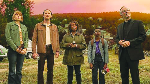 scene from Salem's Lot movie adaptation showing five characters standing on hill above town at dusk