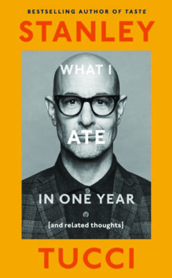 book cover with orange cover, black and white photo of man in center, words What I ate in one year overlapping his face