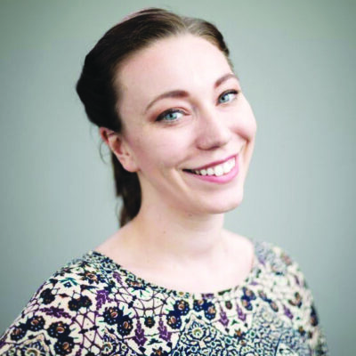 headshot of young woman with large smile