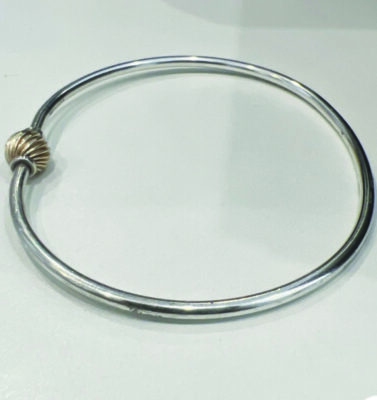 circular silver bracelet with single silver bead