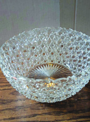 cut glass bowl on wooden table