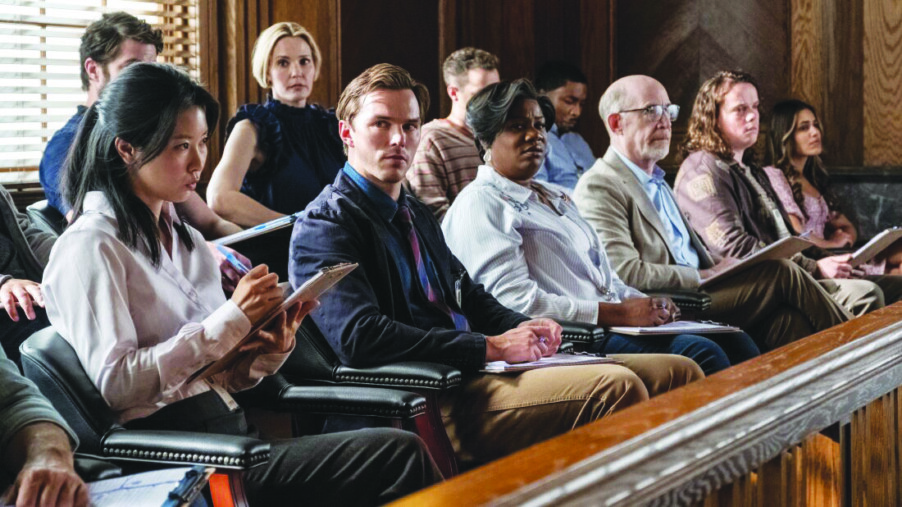 scene from movie Juror #2, showing actors portraying jury sitting in the jury box during trial