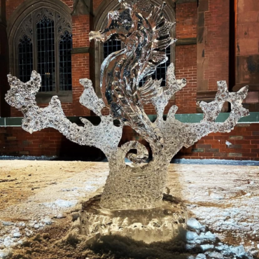 A stunning ice sculpture of a sea horse surrounded by coral