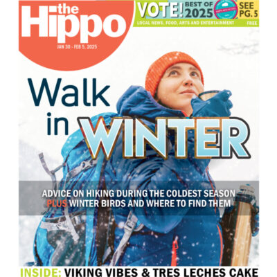 A Hippo cover featuring a woman in a blue coat hiking in the winter drinking from a thermos.