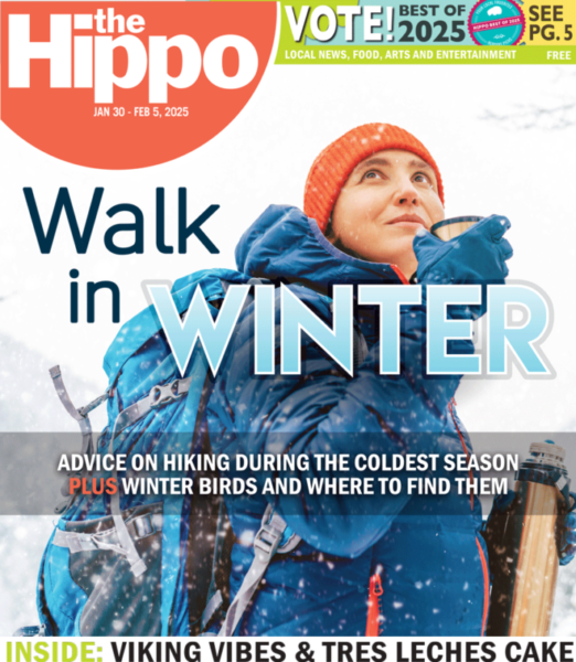 A Hippo cover featuring a woman in a blue coat hiking in the winter drinking from a thermos.