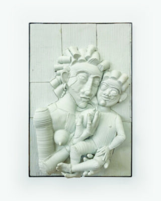 Relief sculpture done in white plaster, showing stylized female figure holding infant to her chest, pressing their cheeks together, mounted on white panels