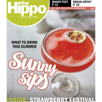 A Hippo cover showing a pretty red drink decorated with a slice of lime.