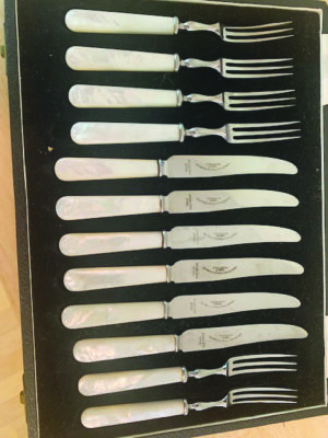 A collection of antique dessert silverware.