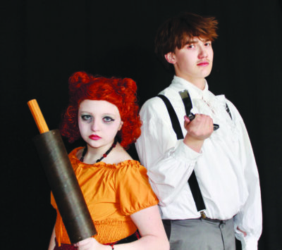 two young actors portraying Mrs. Lovett and Sweeney Todd in a production of Sweeney Todd