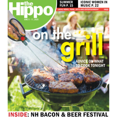 close up of open grill cooking steak tips with people at picnic table in background, title text On the Grill