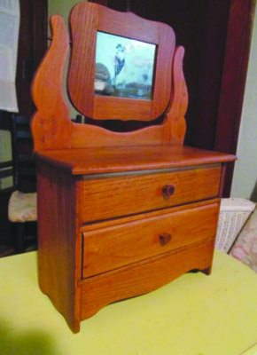 doll sized wooden dresser with two drawers and mounted mirror