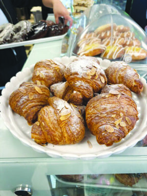 plate of croissants on bakery counter