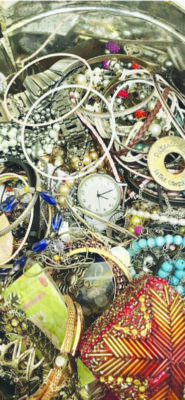 messy pile of assorted jewelry pieces all tangled together