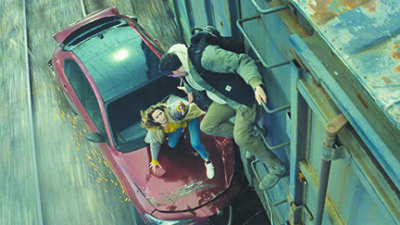scene from Disclosure Day showing woman standing on car as man reaches down from ladder on wall to help her climb up