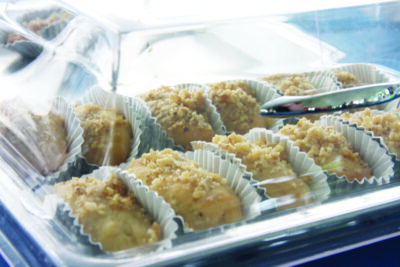 tray filled with Greek pastries in cupcake wrappers