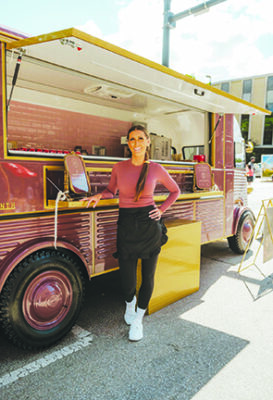 woman standing outside her food truck