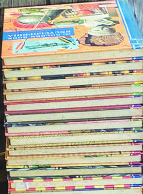 stack of wide hardcover books