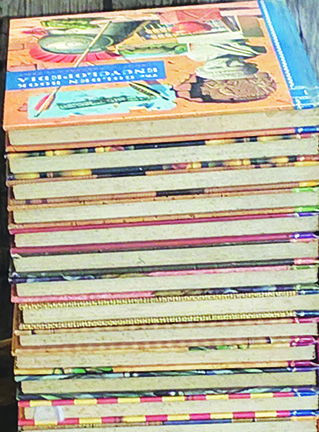 stack of wide hardcover books