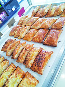 tray of square filled pastry hand pies