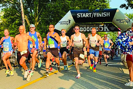 group of runners starting road race in early morning