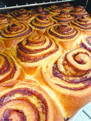 cinnamon buns coming out of the oven