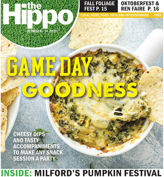 front page of the Hippo showing top view of bowl of cheesy spinach dip with corn chips