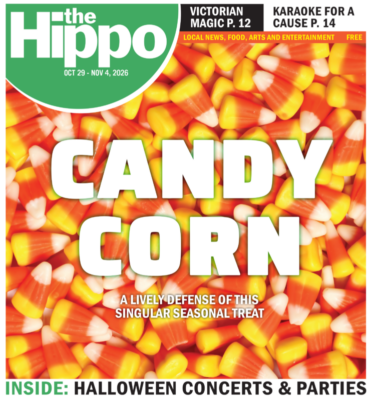 background of candy corn with white text over it